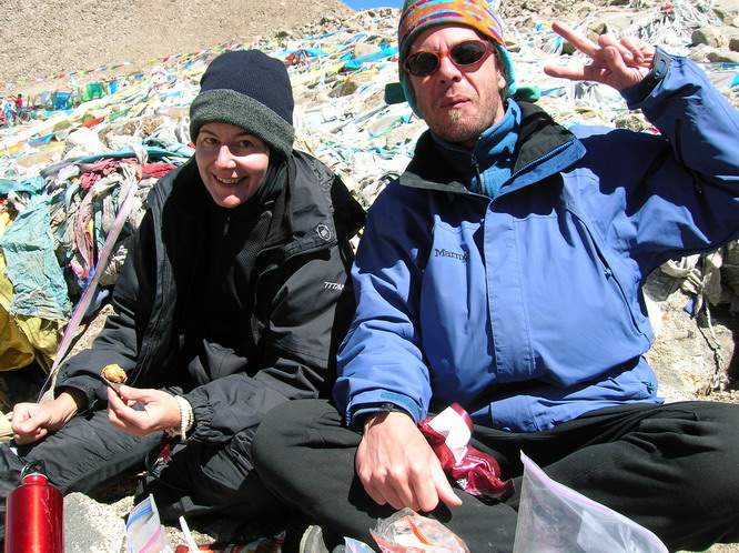 Linda and Ray enjoying some snacks on top of the Dromala Pass (5600m or 18,368 ft). Mt. Kailash, Tibet.